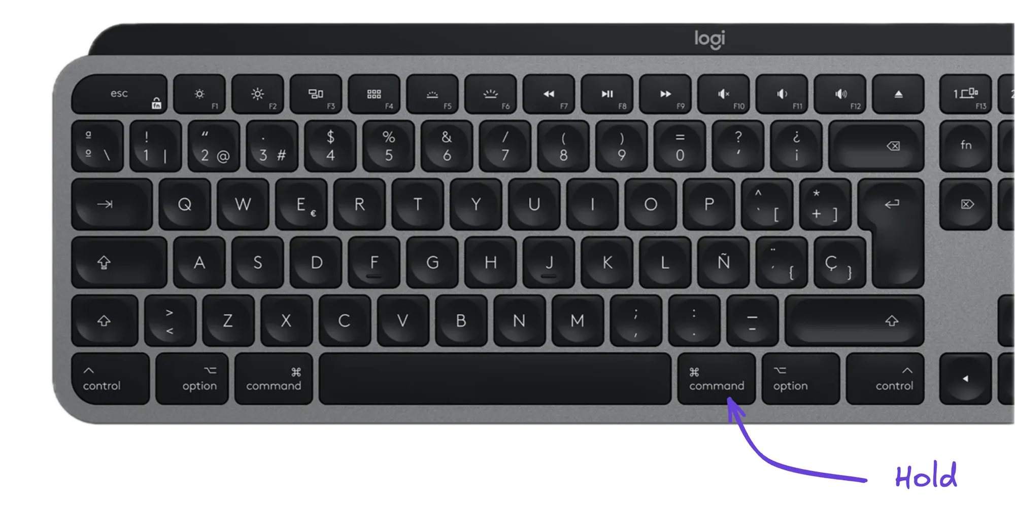 Teclado externo con distribución española: la tecla ⌘ derecha marcada como «Hold», la única que hay que aprender.